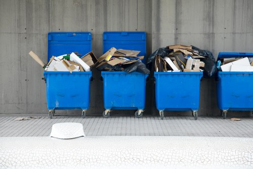 Business team efficiently loading a commercial skip